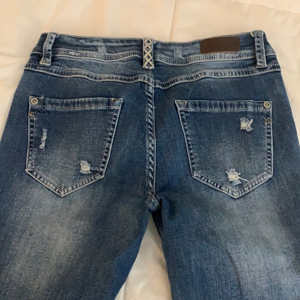 Distressed flare leg jeans